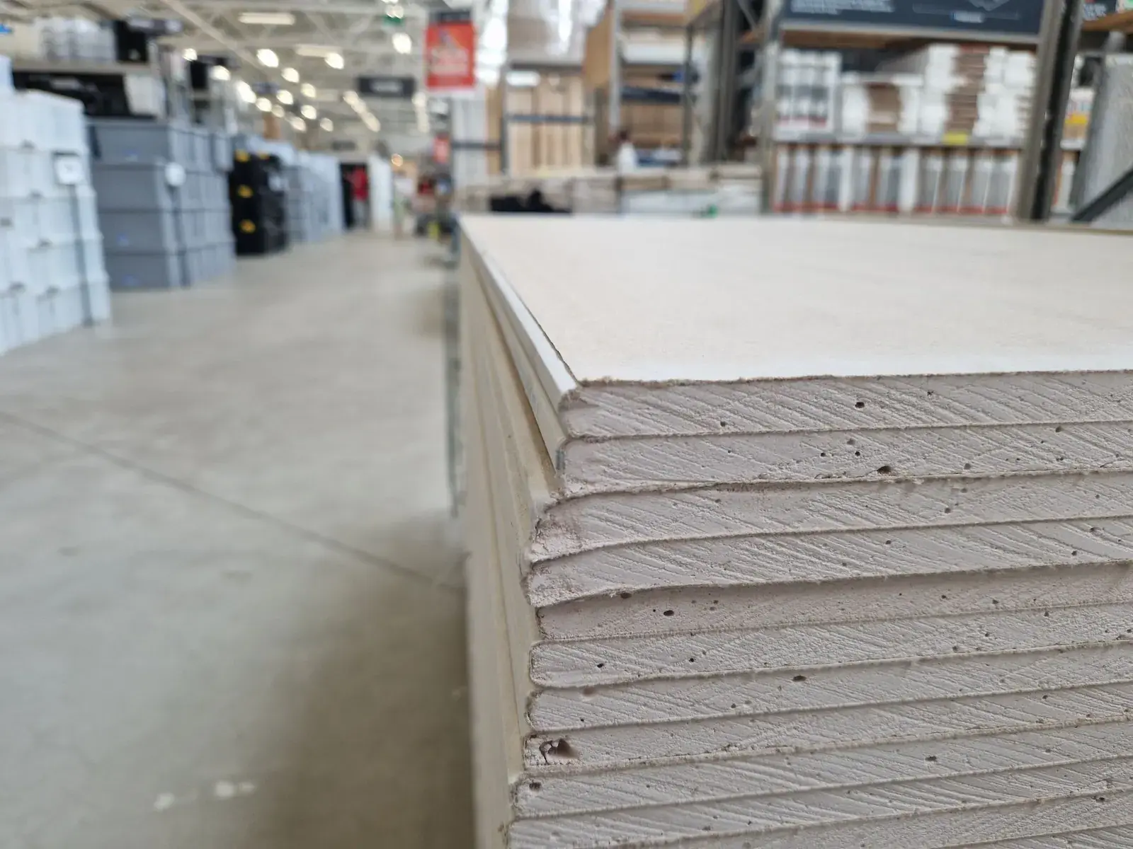 Stack of drywall sheets on a warehouse floor